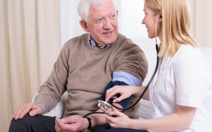 caregiver-checking-the-hypertension-PTJTCKB-e1556543858163