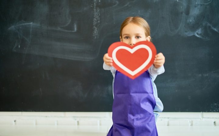 little-child-holding-heart-TNPZW2G