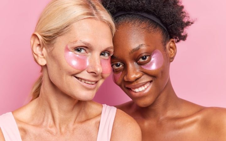 photo-cheerful-two-diverse-women-use-skin-care-products-apply-beauty-patches-eyes-reduce-wrinkles-bags-undergo-eye-skin-treatment-have-glad-expressions-pose-indoor-beauty-concept
